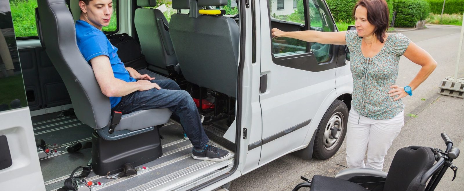 Wheelchair user exiting an accessible vehicle
