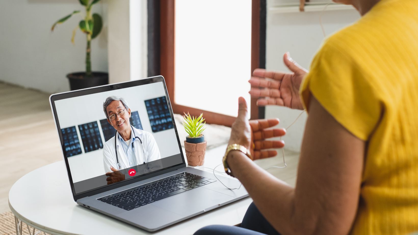 Patient on video call with doctor.