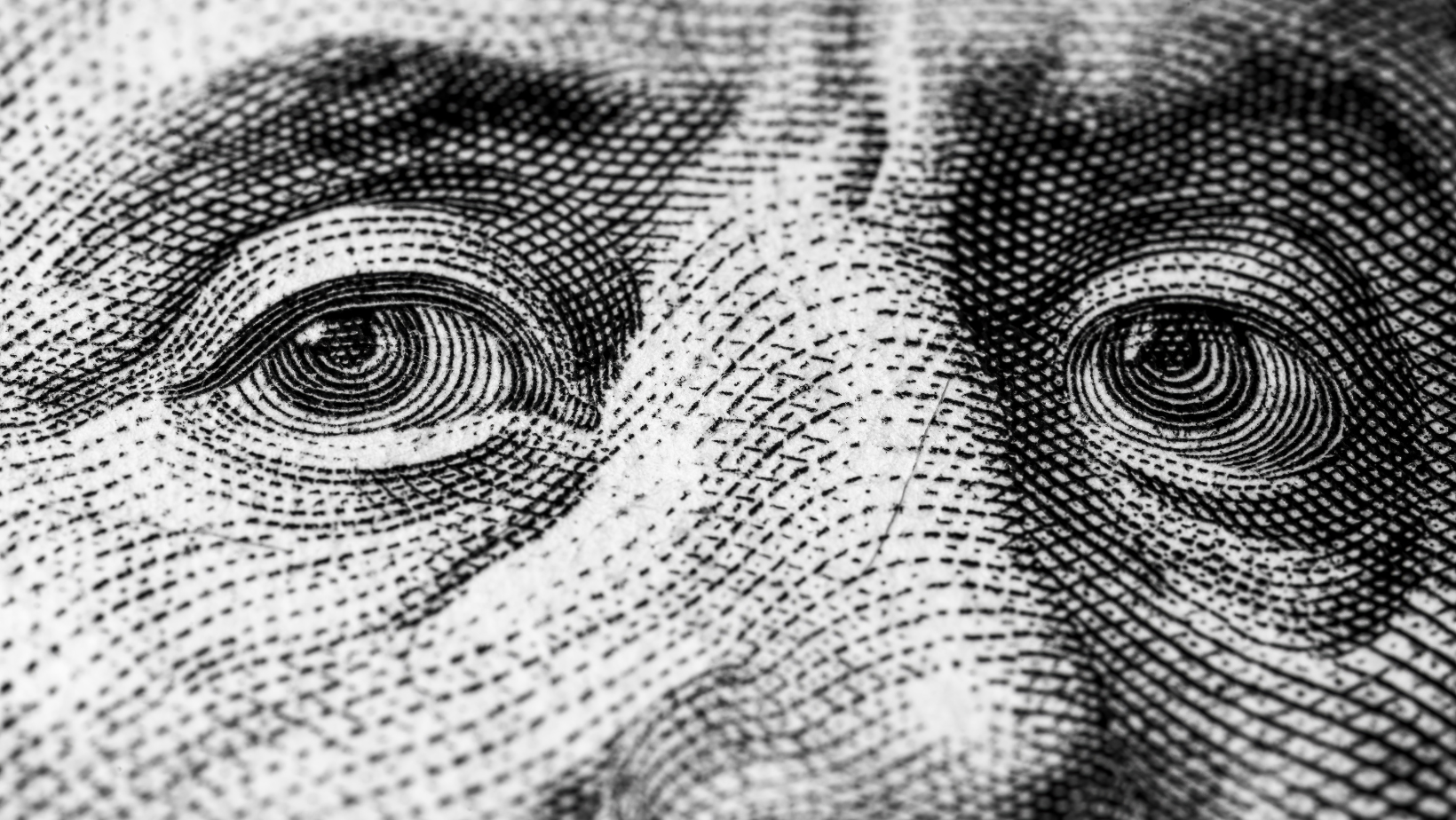 close up of Ben Franklin's eyes on the $100 bill