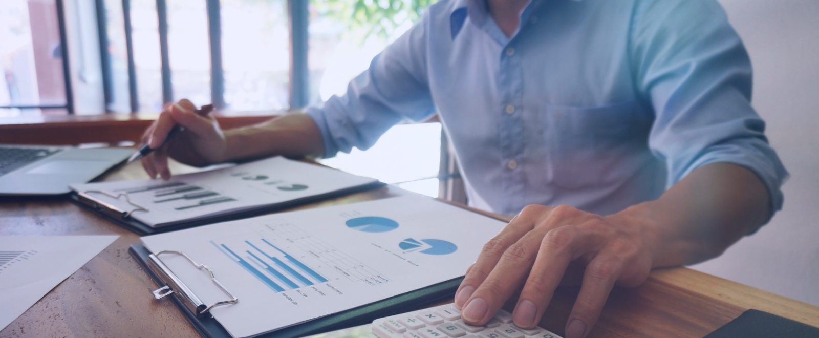 Business owner looking at financial papers.