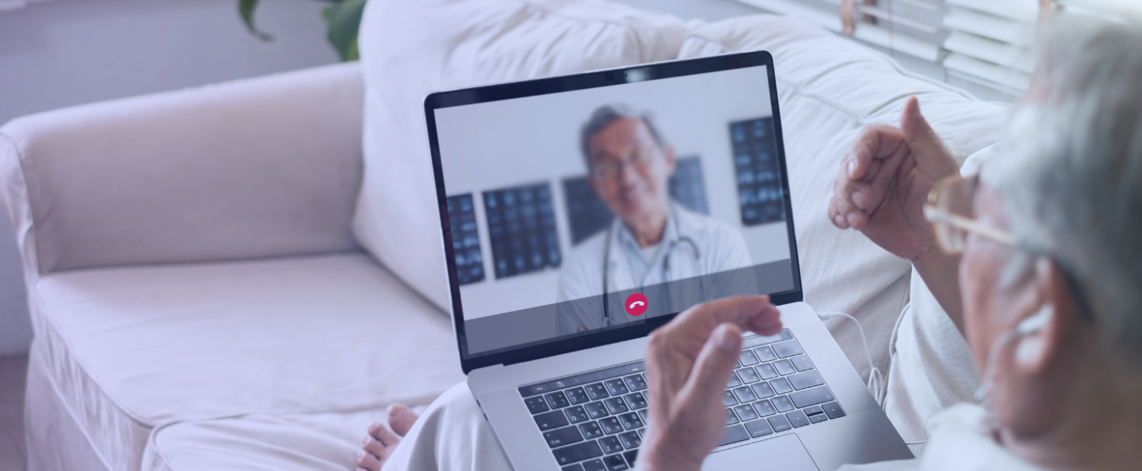 Man on video call with a doctor.
